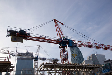 Fototapeta na wymiar Cranes over construction site