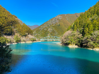 A bridge over a Japanese lake.