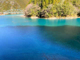 A bridge over a Japanese lake.