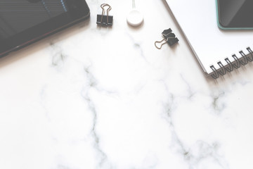 home office essentials on a marble background