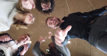 Motivated funny diverse business team people dancing celebrating success at corporate party on friday, happy friendly multiracial coworkers group having fun together enjoy victory dance during brake.