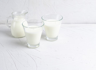 Homemade fermented drink in glasses of kefir or Bulgarian on a white background with copy space.