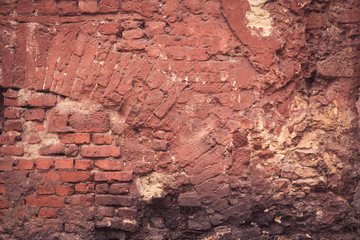 ugly red brick wall background. chaotic street building texture