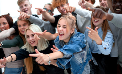 close up. a group of young people pointing at one point