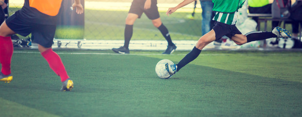 Selective focus to soccer player speed run to control and shoot ball to goal. Soccer players...