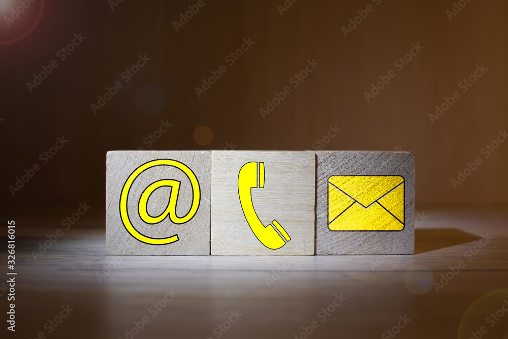 Poster website and internet contact us page concept with colored icons on cubes on a keyboard