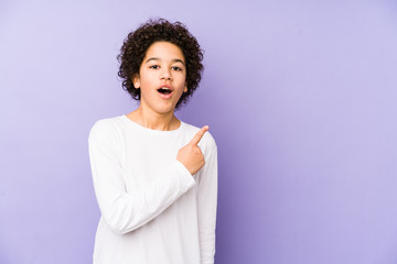 African american little boy isolated pointing to the side