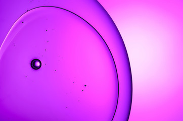 Oil and water abstract macro extreme closeup in purple