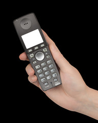 Female hand holds a phone with a white blank screen, isolated on black background