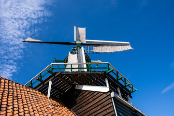 Zaanse Schans, Netherlands - 1 October 2019: Traditional Dutch windmill in Zaanse Schans, a typical small village within Amsterdam area.