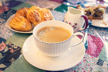 capuchino coffee on vintage style table