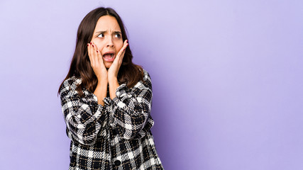 Young mixed race hispanic woman isolated scared and afraid.