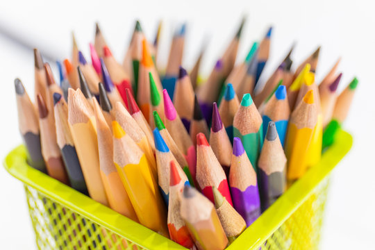 A colored pencil in a yellow basket