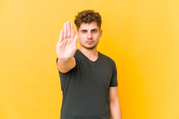  standing with outstretched hand showing stop sign, preventing you.