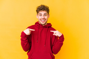  surprised pointing with finger, smiling broadly.