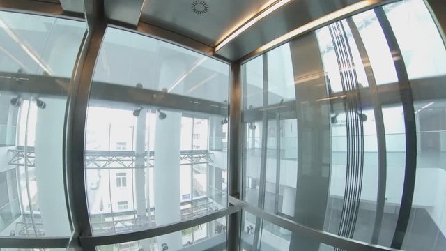 Wide Angle View of Elevator Interior with Glass Walls POV