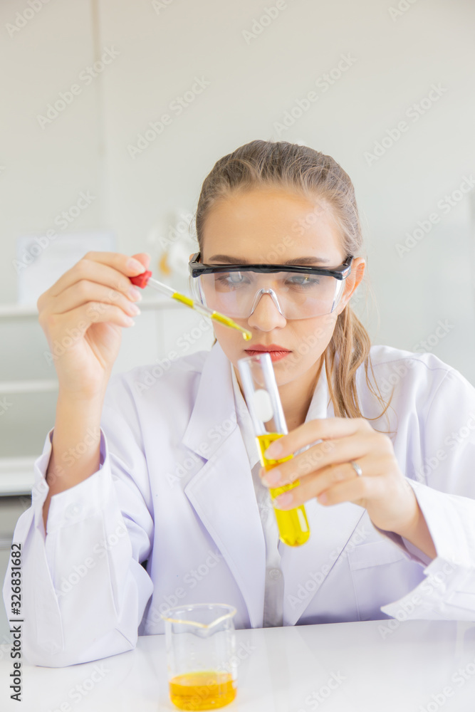 Poster A beautiful female scientist is operating in a science lab with various equipment in the lab.