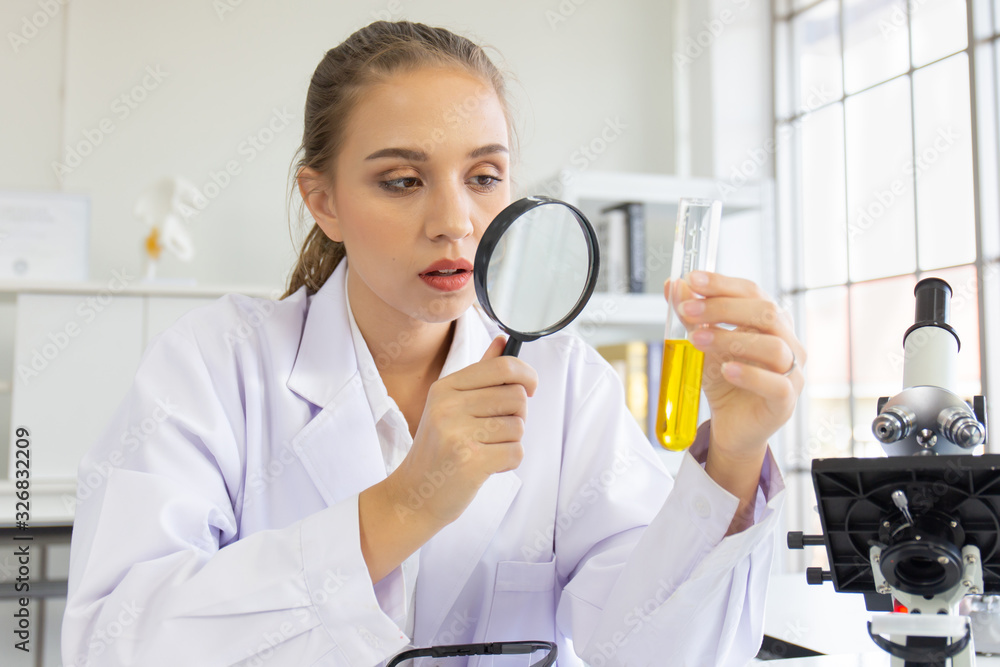 Poster A beautiful female scientist is operating in a science lab with various equipment in the lab.