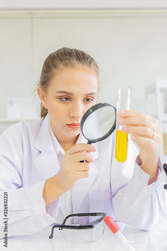 Poster A beautiful female scientist is operating in a science lab with various equipment in the lab.