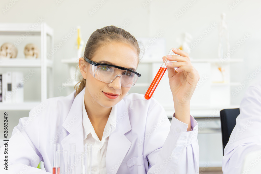 Poster A beautiful female scientist is operating in a science lab with various equipment in the lab.