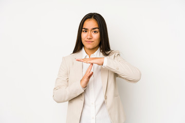 Young woman isolated on a white background showing a timeout gesture.