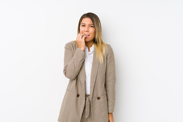 Young caucasian business woman isolated biting fingernails, nervous and very anxious.