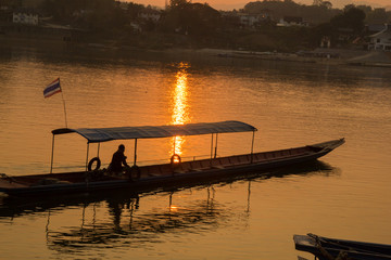 boat on Mekong river during sunset