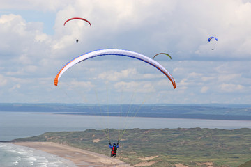 Paragliders flying above Rhossili	