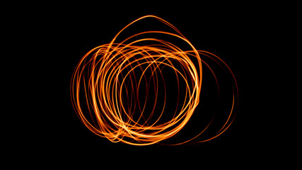 Steel wool burning orange sparks abstract light art circles isolated on black background and copy...