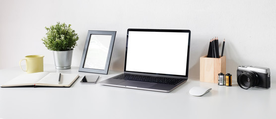 Fototapeta premium Workspace desk and laptop. copy space and blank screen. Business image, Blank screen laptop and supplies.