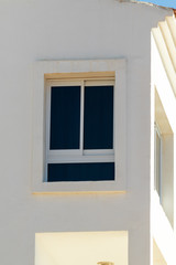 Minimal background in architectural style. White walls against the blue sky.