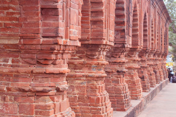 beautiful column of old temple made up of red bricks