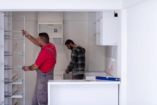 workers installing a new kitchen