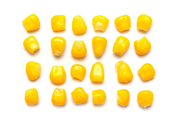 Yellow corn seeds isolated on a white background.