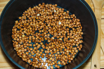 Step by step vegetarian craft burger.Healthy food, dieting, concept vegan protein source. Raw of legumes (carrots, red lentils, pepper, potato). Top view.