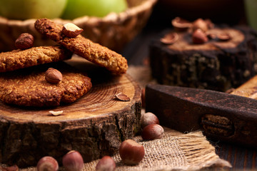 homemade oatmeal cookies with hazelnuts on wooden background