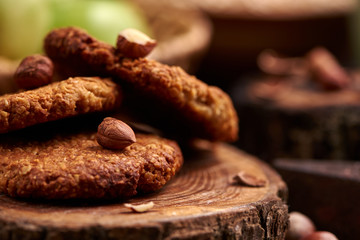 homemade oatmeal cookies with hazelnuts on wooden background