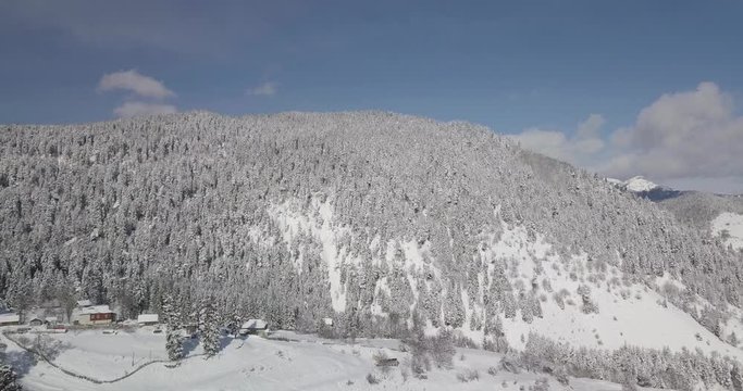 Aerial shot of ski resort bakuriani, Didveli area, in shot car parking, ski gondola lift station, group of people and skiers in winter