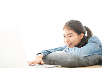 Asian young woman relaxing using laptop computer for watch movies from internet media entertainment