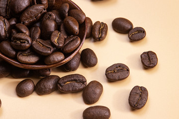 Grains of coffee on a brown background.