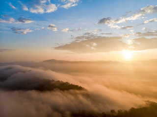 Obraz premium Aerial view forest in morning fog mist, breathing mountains, Sunshine on The Morning Mist
