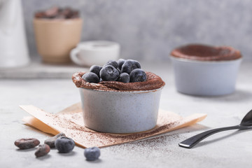 Chocolate Souffle with frozen blueberry . French traditional dessert.