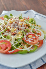 Tuna salad with red raw tomato, fresh lettuce. Hight vitamins and low fat for loose weight. Heathy food concept.