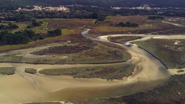 Natural water canals of the coast of Carnota, Spain. Rotating drone aerial view.