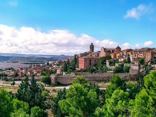Fototapeta na wymiar Panorama of the valley with the medieval town of Cervera on a hill (Catalonia, Spain). Beautiful spanish landscape in autumn sunny day