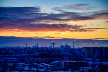 Photo of a morning cold sky over a city with sunrise