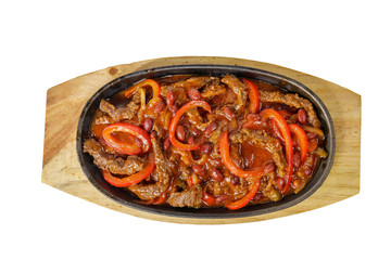 fajita, beans and bell peppers with meat, beef, lamb, goulash, fried, baked portion on a hot frying pan, on a wooden board on white background view from above. For the menu