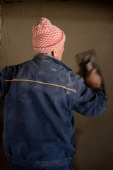 Fototapeta na wymiar Worker plastering the wall by concrete