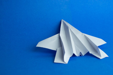 Paper plane on a blue background