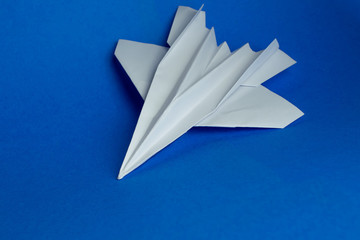 Paper plane on a blue background